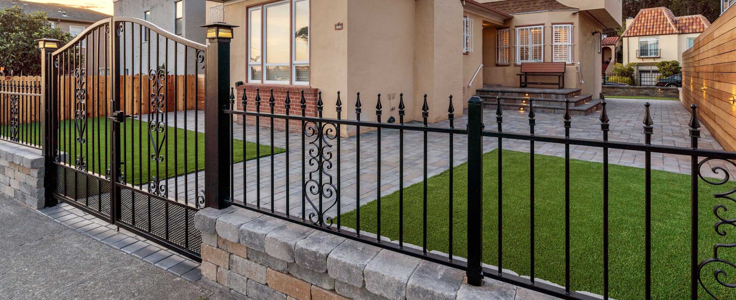 Landscaping, iron gates, stone fence and stobe bricks car entry in tha Bay Area