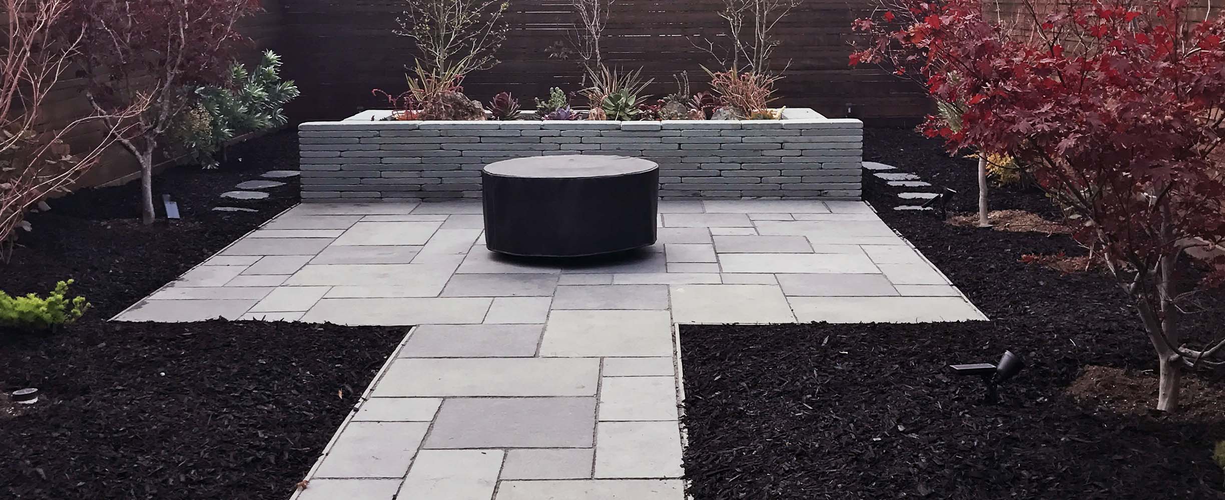 landscaping project in San Francisco home with stones path and a stone water fountain feature.