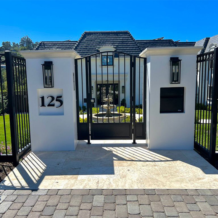 An elegant estate garden entrance matching the traditional house.